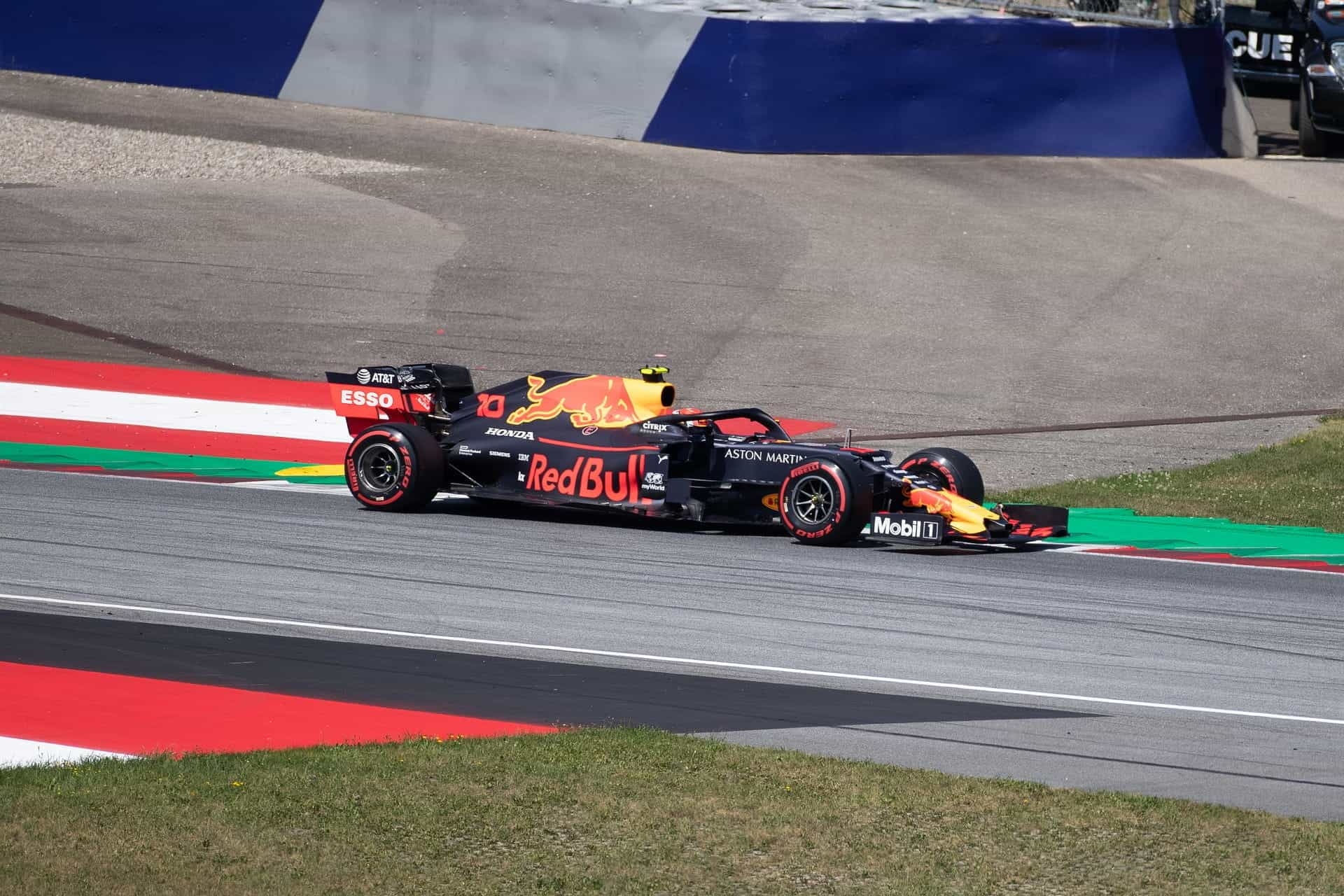 A Red Bull Racing Honda racing car on a track.