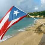 A Puerto Rican flag waves on the observation tower on the beach at Punta Borinquen.