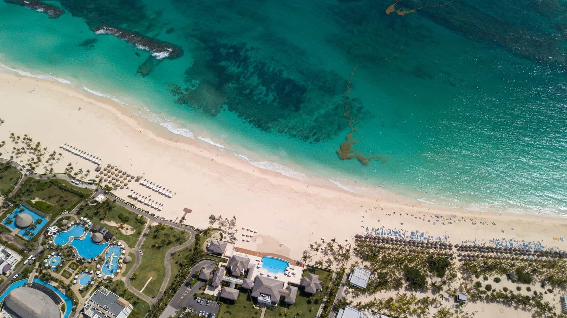 Aerial shot of the Hard Rock Punta Cana complex on the beach.