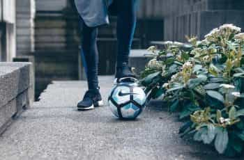 A footballer with a ball.