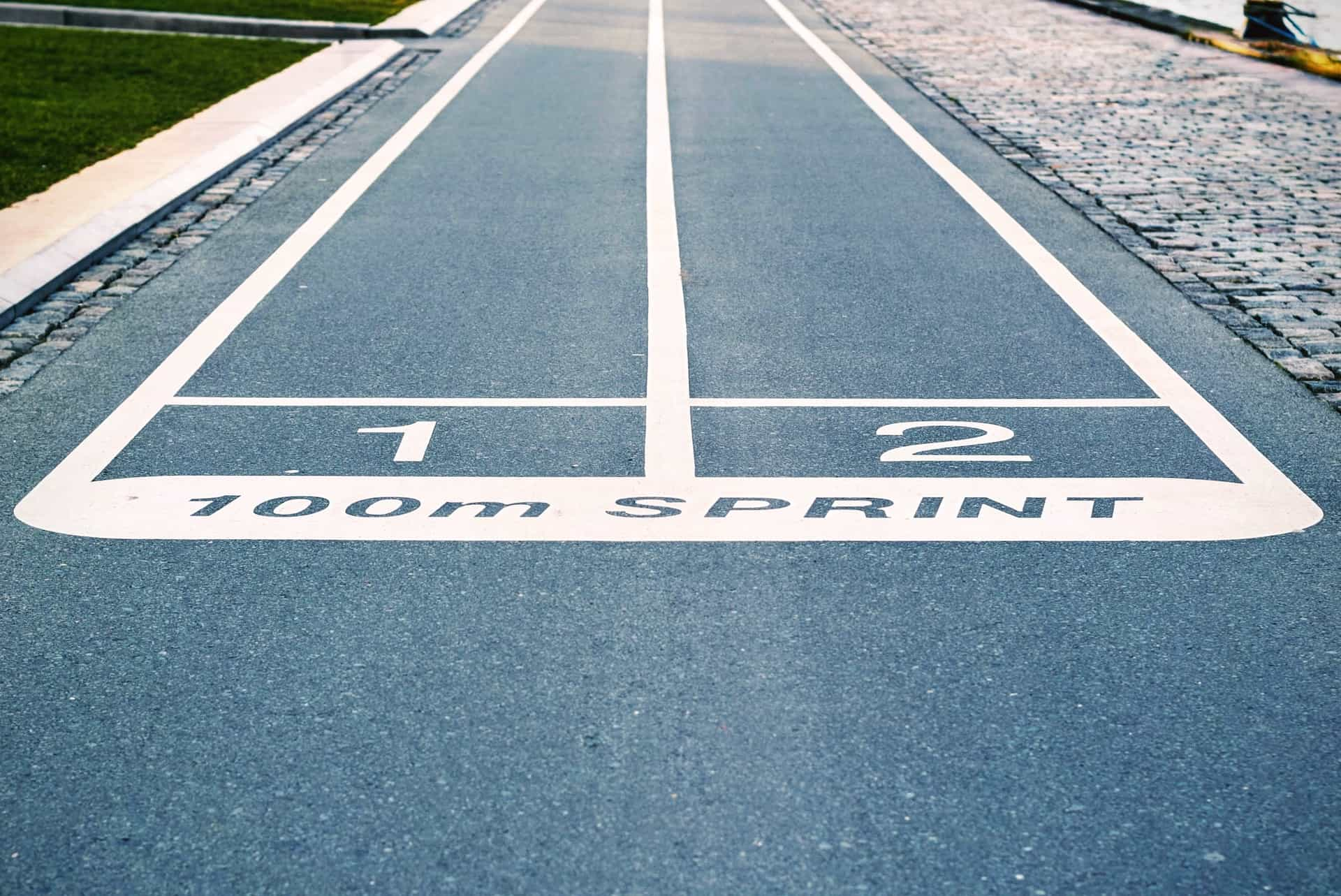 The first and second places at the starting line for a 100m race.